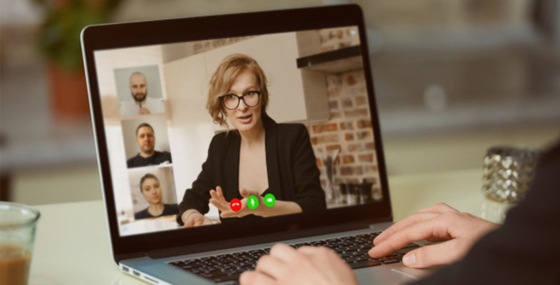 Supervisor in virtual meeting with remote team