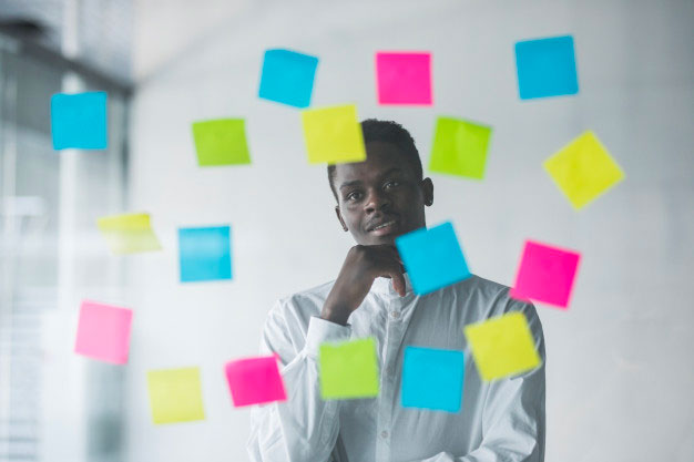 man pondering on plans